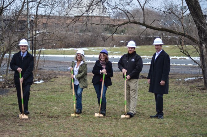 Jim Cornwell, Beth Clifford, Herndon Mayor Lisa Merkel, Rob Cappellini, and Warren Ralston pose for a photo during the groundbreaking ceremony for the new Vinehaven homes development.
