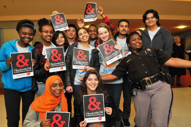 Members of the T.C. Williams Influence Club pose for a photo with Deputy Sheriff Valarie Wright.
