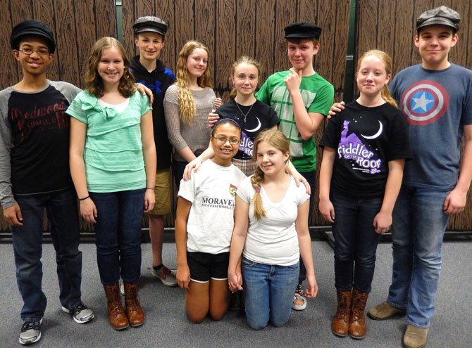 The lead actors include (standing, from left) Caton Gayle, Brooklynn Pendleton, Paul Anderson, Laura Cantagallo, Margot Vanyan, Jared Renaud, Jensyn Volpe and Maxwell Leitch; and (kneeling, from left) Mya Baptiste and Savannah Gregory.