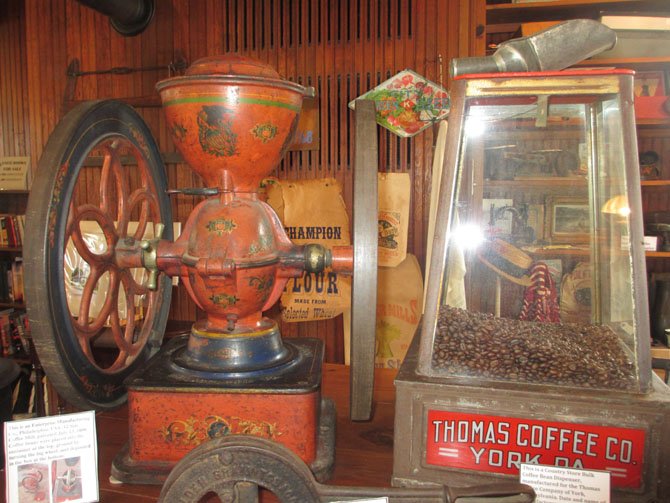 Turning the grinding wheel of this turn-of-the-19th-century coffee grinder ground the beans from the top container.