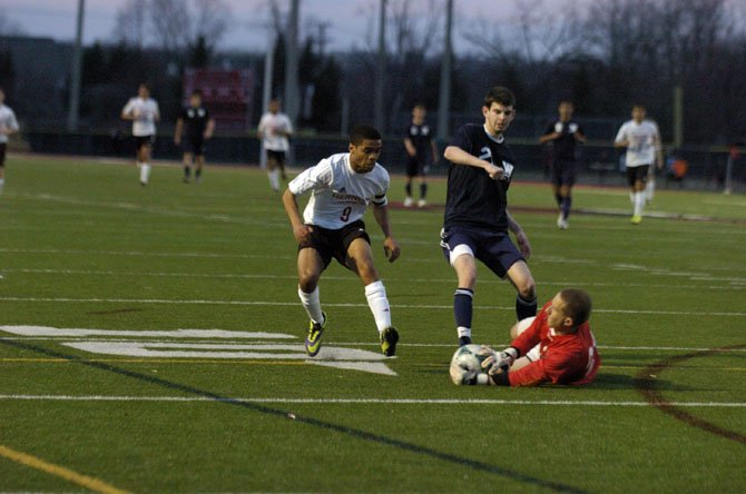 Herndon senior Brian Maye, left, scored two goals during the Hornets’ 3-1 victory over Woodson on March 28.