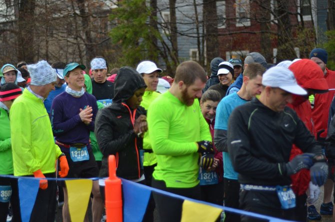 Participants in the Reston Runners March half marathon make final preparations at the starting line. At the end of the day, new course records were made.