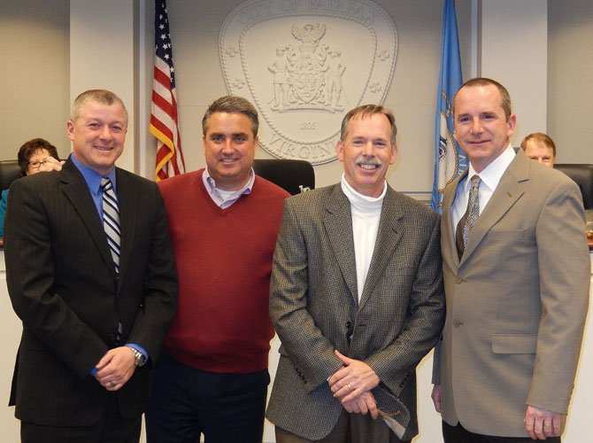 (From left) Parks and Recreation Director Michael McCarty, Mayor Scott Silverthorne, CAC Chairman Kirk Holley and Parks Manager Gregg Tonge. McCarty and Tonge were honored for the Community Garden.