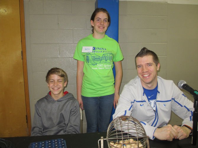 Pizza/Bingo coordinator Julia Goyer with volunteers Thomas Maccas, putting in Thoreau service hours, and Vienna Elementary School music teacher Dave Reynolds calling Bingo numbers.