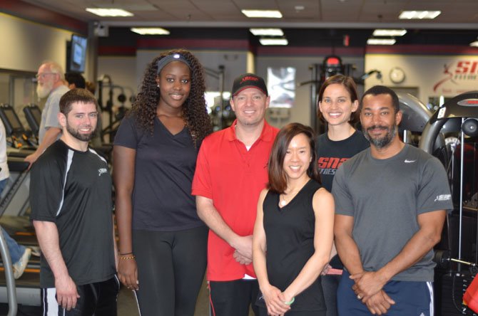 Snap Fitness staff Sean Boyd, Assiatou Kama, Sean Boyd, Jackie Le, Andrea Wallenhorst, and David Jordan at the Snap Fitness at Herndon Kmart Shopping Center on Elden Street.