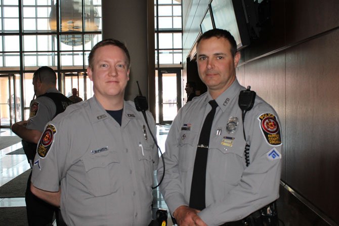 School Resource Officer Rich Barron and Mike Scanlon, president of the Fairfax Fraternal Order of Police, were among the hundreds of police officers who attended the public hearings on the Fairfax County budget at the Government Center on April 10.