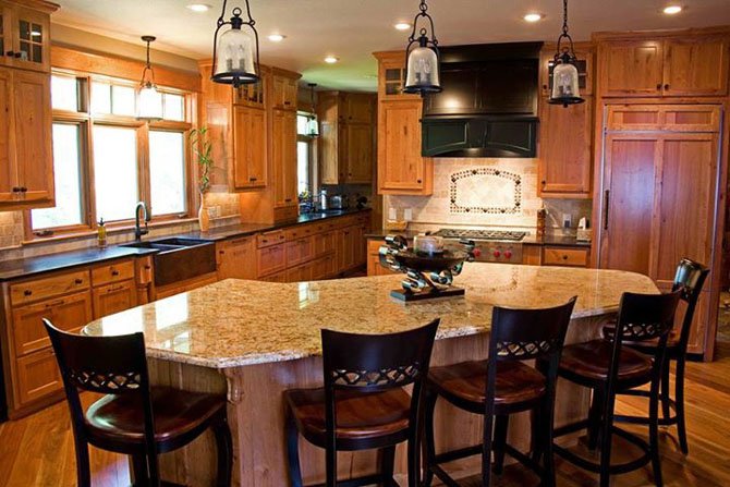 This kitchen, designed by Two Poor Teachers, includes a large entertainment island. Realtors say attractive kitchens help homes sell quickly.
