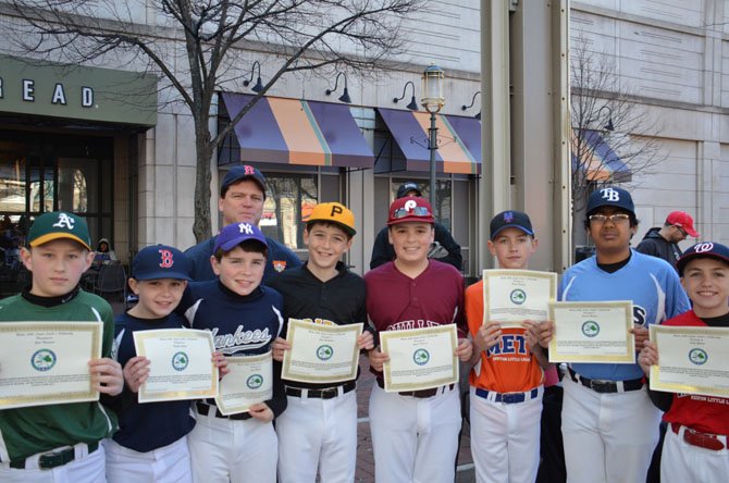 Reston Little League Leader’s Scholarship Awardees pictured left to right: Jack Thompson, Nick Gryski, Josh Meade, Shea Huntington, Aiden O’Donovan, Braden Huebsch, Vikrant Magadi, and Sully Gholson with Sean Dooley of The Wise Investor Group in Reston.
