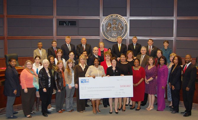 From left – first row: Claire Louis and Susan Davidson, Wesley Housing Development Corp, Ileana Arrieta, Hispanics Against Child Abuse and Neglect, Marie Markey, Annandale Christian Community for Action, Malinda Langford and Gail Coleman, Northern Virginia Family Service, Carrie Idol-Richards, Insight Memory Care Center, Melissa Jansen, Western Fairfax Christian Ministries, Rosie Allen-Herring, President and CEO, United Way of the National Capital Area (United Way NCA), Sharon Bulova, Chair, Fairfax County Board of Supervisors, Amanda Andere, Facets, Lisa Whetzel, Our Daily Bread, Ingrid Parris-Hicklin, Dana Lewis, United Way NCA Fairfax/Falls Church Regional Council, Tim Maples, United Way NCA Fairfax/Falls Church Regional Council; second row: Tammy De Martino, Kathy Banks, Falls Church/McLean Children Center, Sree Kumar, Literacy Council of Northern Virginia, Joe Meyer, Shelter House, Denise Daffron, Jill’s House, Denise Miller, American Red Cross, Thomas Wilson, Northern Virginia Dental Clinic, Sonia Quiñónez, Stop Child Abuse Now of Northern Virginia, Patti Stevens, United Way NCA Fairfax/Falls Church Regional Council; top row :Supervisors Catherine M. Hudgins (D-Hunter Mill), Michael R. Frey (R-Sully District), John C. Cook (R-Braddock District), Gerald W. Hyland (D-Mount Vernon), Penelope A. Gross (D-Mason District, Vice Chairman), John W. Foust (D-Dranesville), Jeffrey C. McKay (D-Lee District), Pat Herrity (R-Springfield District), Linda Q. Smyth (D-Providence District). 
