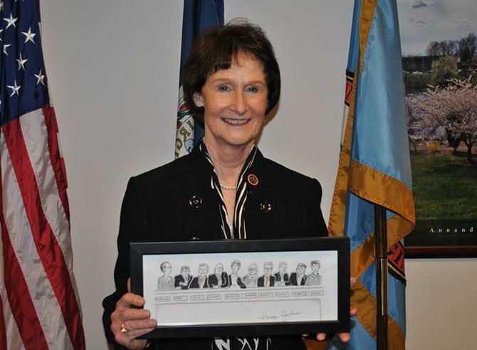 Fairfax County Board of Supervisors Chairman Sharon Bulova holds the artwork she created for the event.
