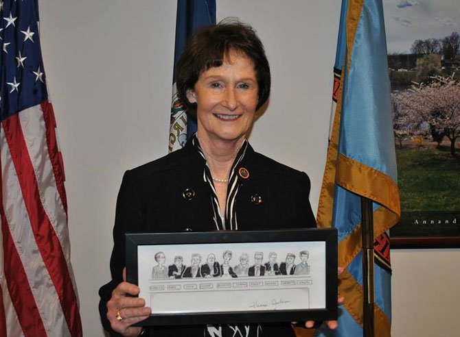 Fairfax County Board of Supervisors Chairman Sharon Bulova holds the artwork she created for the event.
