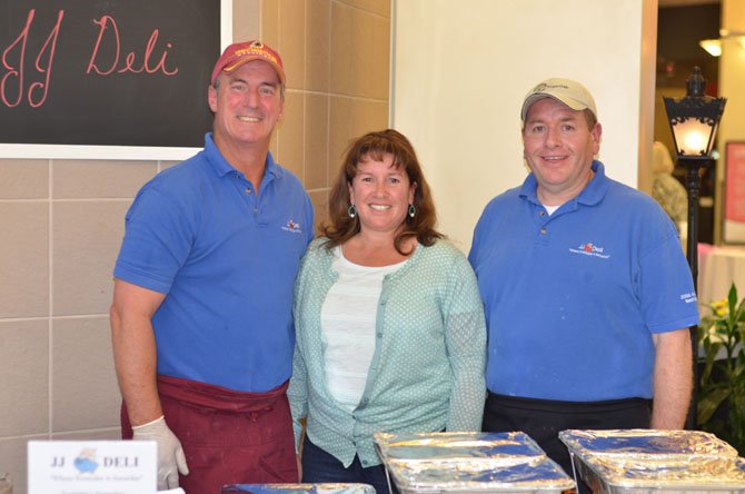 Jeff, Jackie and Horacio Johnson by their stand for the family run business JJ Deli at the April Taste of the Town event at Herndon Worldgate Center.
