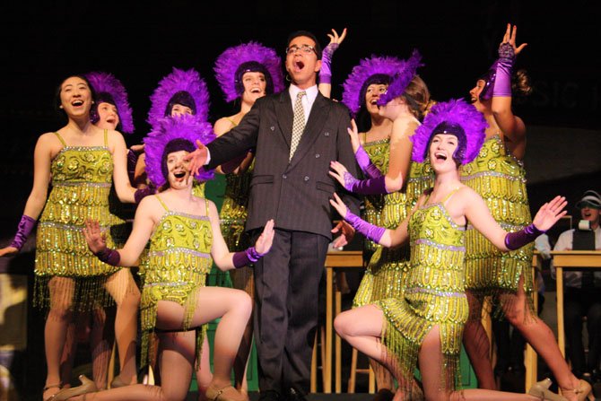 Cameron Powell (Leo), surrounded by showgirls, sings "I Want to be a Producer."