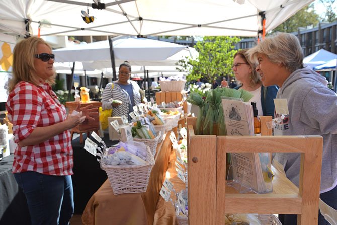 The Open Air Market in the Lake Anne Plaza is also open for business. Featuring artisans, global imports and health products like the many “Beehive Remedy” offerings of InterNutrionals, LLC of Oakton. Michele Bucharnikov had her hands full with customers a plenty.
