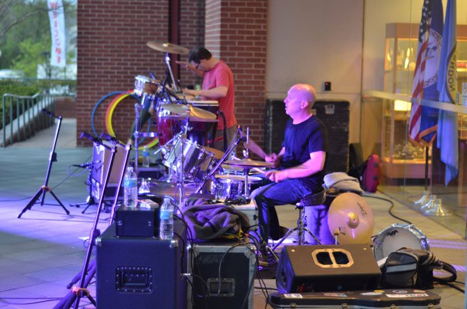 Musicians Paul Voshell on the drums and David James handled percussions at the May 2 Friday Night Live Concert at the Town of Herndon.