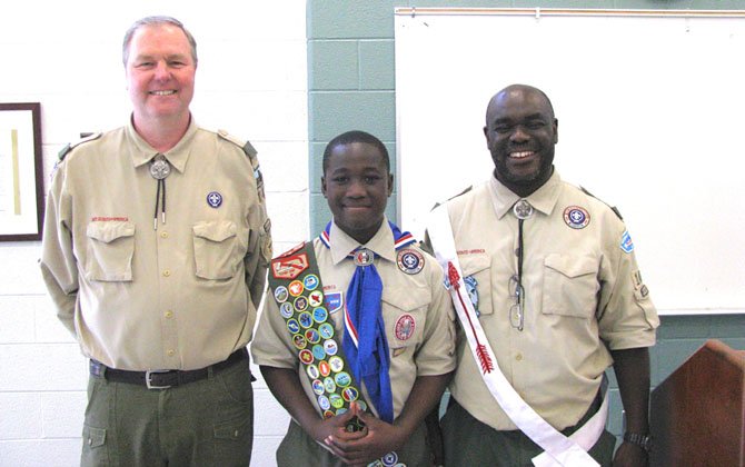 Scoutmaster Kevin Gaughan (left), Boy Scout Chiti Tembo and his father Assistant Scoutmaster Mulenga Tembo.
