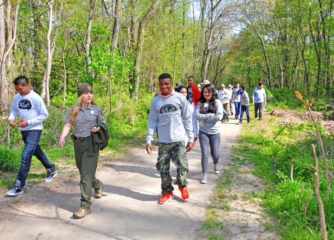 Sarah Gamble, a park ranger with the National Park Service, walked T.C. Williams International Academy students to the focus areas in Dyke Marsh.