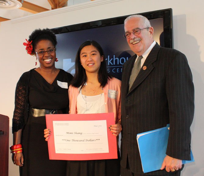 Mimi Shang of James Madison High School in Vienna receives her first place award in the Congressional Arts Competition from Congressman Gerry Connolly and judge Rachelle Etienne-Robinson of the Arts Council of Fairfax County. The winners were announced at a reception held at the Workhouse Arts Center in Lorton.

