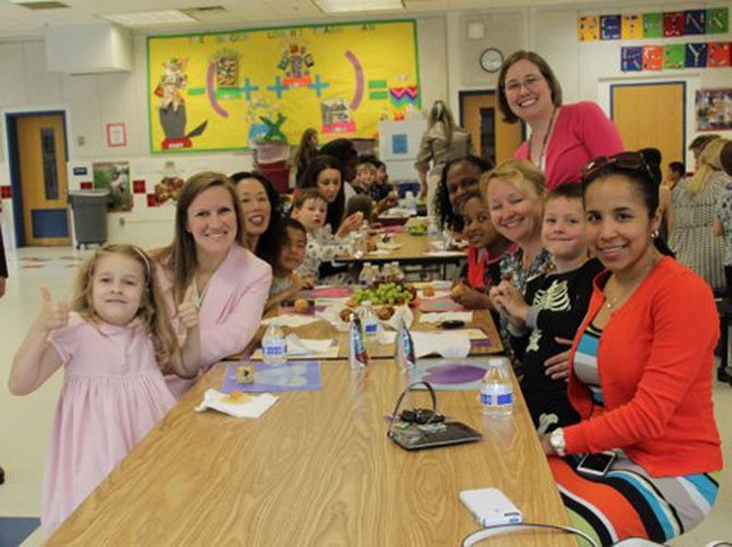 Churchill Road kindergarten students and their parents celebrated Mother’s Day with homemade muffins and other treats. From left are Elizabth Maclay and mom Christine Maclay, Anne Kim and son Elliot Pomper, Keira Buggs and daughter Julia Jackson, Erin Thurston (kindergarten teacher, standing), Julie Broad with son Finnegan and nanny Yurany Del Castillo Reyes.
