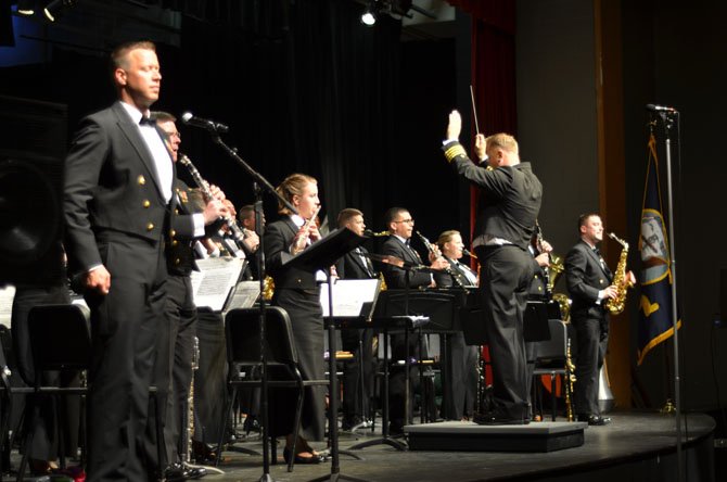 The U.S. Navy Concert Band conducted by Captain Brian O. Walden played at Herndon High School on May 9. At the end of the concert, the U.S. Navy band played songs associated with the uniformed services of the United States. 
