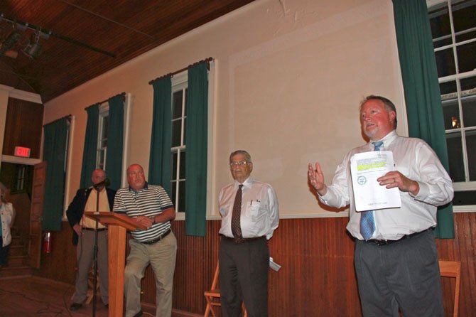 GFCA Executive board member Ralph Apton and FCPS Capital Projects coordinator Stephen Nicholson listen to questions at the town hall meeting May 13.
