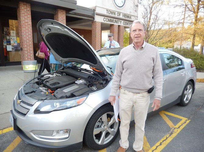 Dennis Dineen with his electric-hybrid Chevy Volt.
