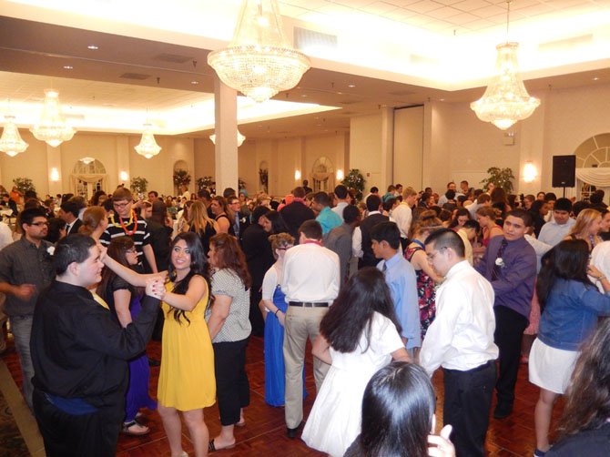 Under crystal chandeliers, students have fun on the Waterford dance floor.  
