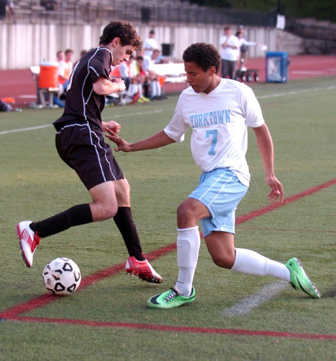 Yorktown forward Michael Monahan, right, scored the game-winning goal in sudden-death overtime against Madison during the Conference 6 tournament quarterfinals on May 16.