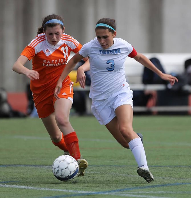 Senior midfielder/forward Alex Puletti, right, scored one of the Yorktown girls’ soccer team’s seven first-half goals during an 8-0 win over Hayfield on May 16.