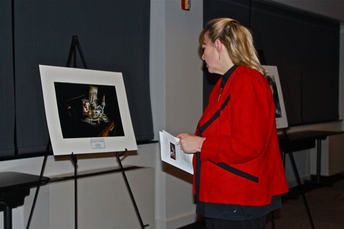 Parent Kim Johnson looks at some of the winning photographs at the 10th Annual Technology and the Arts Competition Awards.
