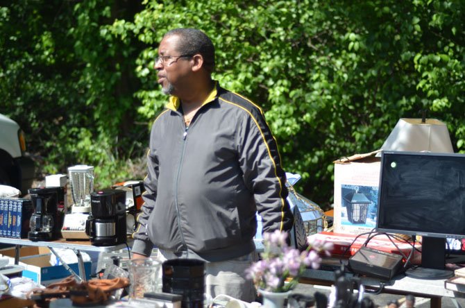 Alexandria resident Alfred Carter by his vending station at the Reston biannual yard sale hosted by the Reston Association. Carter was one of 95 participants in the May biannual yard sale.
