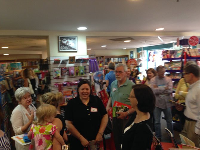 Tutors select books at Hooray for Books to give to their students.