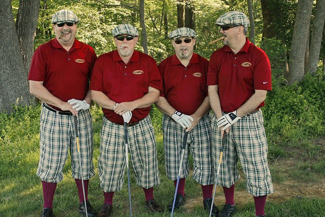 The late Willie Taylor, at left, is shown with former golfing companions Bill Olgletree, Ken Morris and Henry Starky at a previous ASF golf tournament. This year's tournament was held in Taylor's memory.
