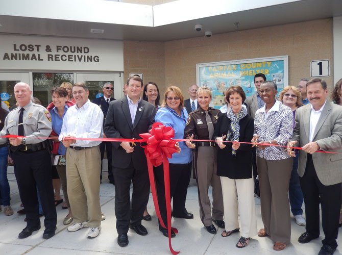 Cutting the ribbon on the newly renovated Animal Shelter are (from left) Police Chief Ed Roessler Jr., Michael Frey, Pat Herrity, Tawny Hammond, Sheriff Stacey Kincaid, Sharon Bulova, Cathy Hudgins and Dave Rohrer.
