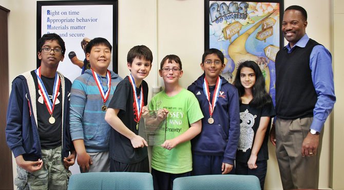 After taking winning the regional and state competition, Rocky Run Middle School will compete at the Odyssey of the Mind World competition at Iowa State University later this month. From left are Bharath Mathivanan, Daniel Hwang, Matthew Lichtblau, Maxwell Tabarrok, Rahil Shah and Shree Trivedi. With the team is Principal Anthony Terrell.
