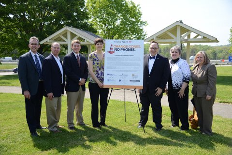 Representatives from chambers throughout the area, including Holly Doughtery, president of the Mount Vernon-Lee Chamber of Commerce (far right) and Nancy-jo Manney, president of the Greater Springfield Chamber of Commerce (fourth from left) posed with project staff with a signed pledge to discourage distracted driving.
