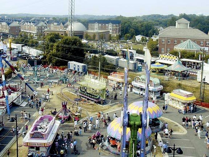 The parking lot between Center Street and Station Street has historically been the site of carnival rides and games during the Herndon Festival.
