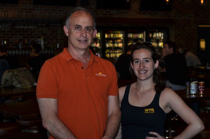 World of Beer Restaurant owner Evan Metz and Director of Operations Heather Matz smile for a photo at the Reston WOB location.
