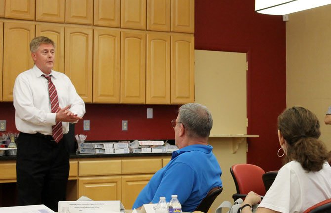 Burke residents listen as Braddock Supervisor John Cook begins a class of his Neighborhood College Program on May 22.
