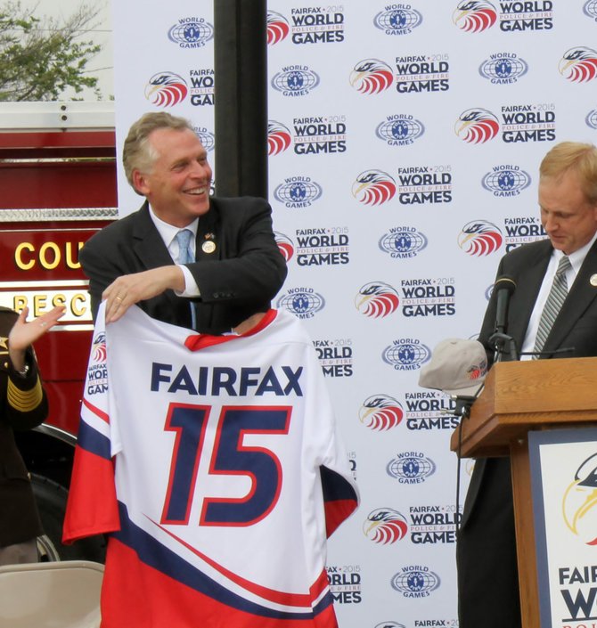 Governor Terry McAuliffe is presented with a 2015 World Police and Fire Games jersey on May 21.
