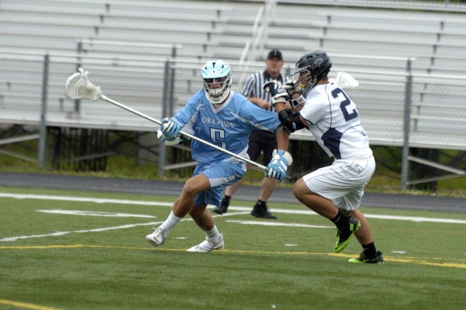 Yorktown defenseman Timothy Aldinger (5) helped limit the South County boys' lacrosse team to its lowest goal-scoring output of the season during the Patriots' 13-6 victory in the 6A North regional quarterfinals on Thursday.