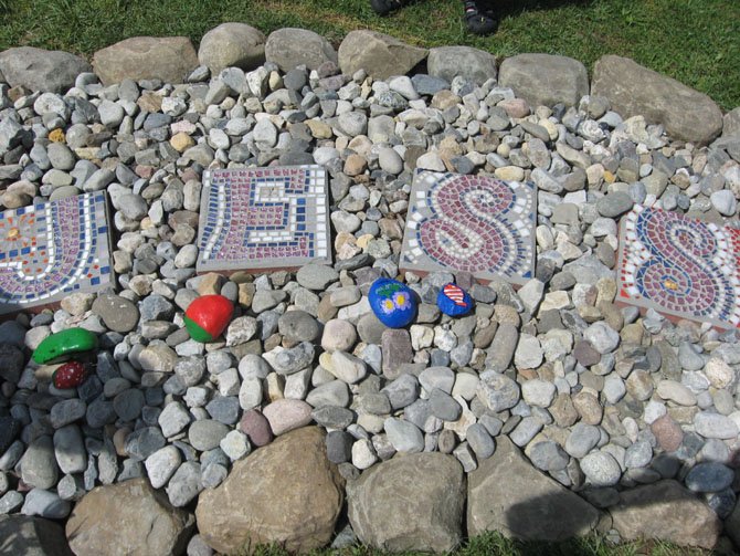Mosaic tiles spell out Jessica’s name at her garden’s entrance path. According to art teacher Anne Nagy, the mosaics were a time-consuming aspect of the garden’s creation, but one that allowed for collaboration between students and staff.