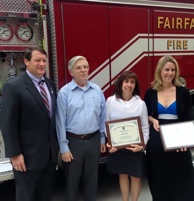 Supervisor Pat Herrity and Michael Martinka stand with Mary Ager and Dayna Cooper, who recently received Citizen Recognition-Lifesaving Awards for performing CPR on Martinka and saving his life.