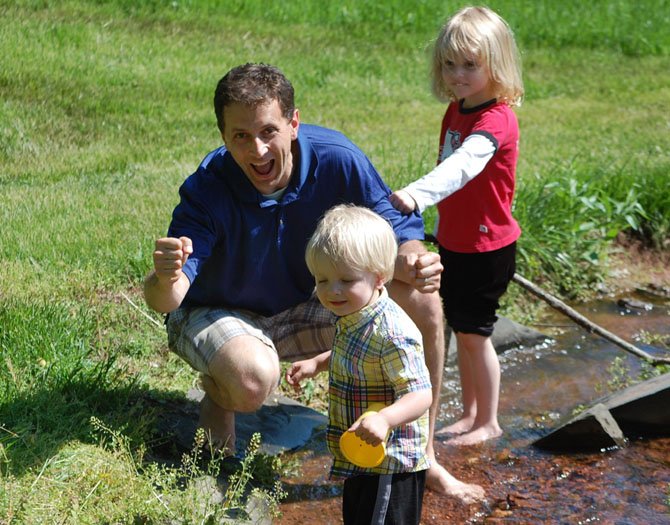 Daddy having fun with his kids! Submitted by Katherine Honea of Herndon.