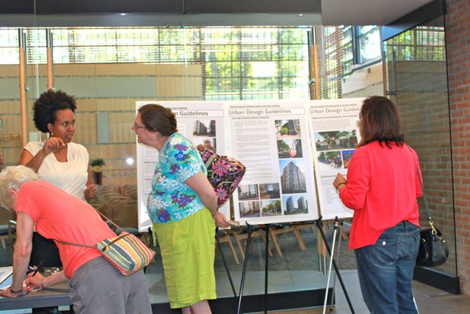 Residents look at urban design guidelines during Reston Phase II open house Saturday at United Christian Parish.