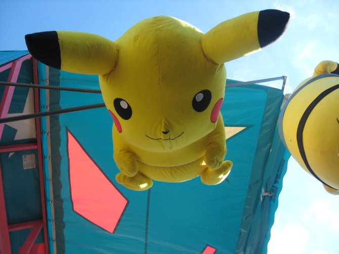 A giant plush toy Pikachu of Pokémon fame hangs from the ceiling of one of the Festival’s many carnival booths. Children of all ages competed in games, such as spraying a target with a water gun or shooting free throws with a basketball, for a chance to win prizes such as this one.