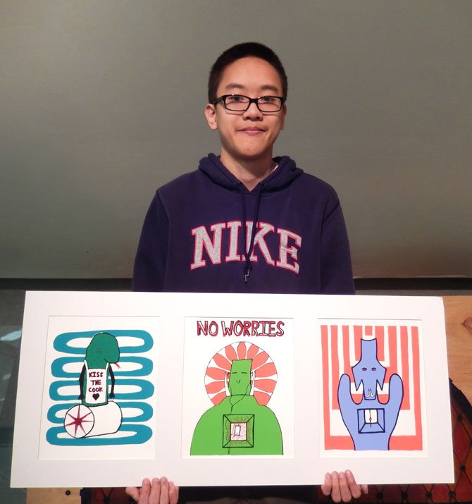 Jason Ly with his award-winning prints, (from left) “Kiss the Cook,” “No Worries” and “Doggy,” 