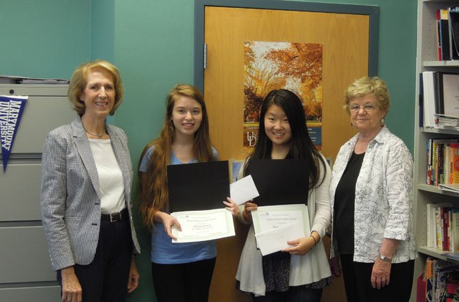 Eliza Price, second from left, and Lauren Yeom, second from right, juniors at McLean High School, are shown receiving their academic achievement awards from the McLean Area Branch of AAUW. The awards were presented by Peg Stotz, far right, incoming co-president of the McLean Area Branch, and Judy Page, far left, STEM coordinator for the branch.