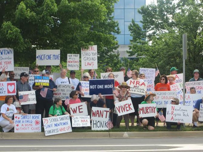 Every 14th of the month since the Sandy Hook Elementary School shootings in Connecticut, Brady Center members have been holding a one-hour vigil outside of the National Rifle Association headquarters in Fairfax
