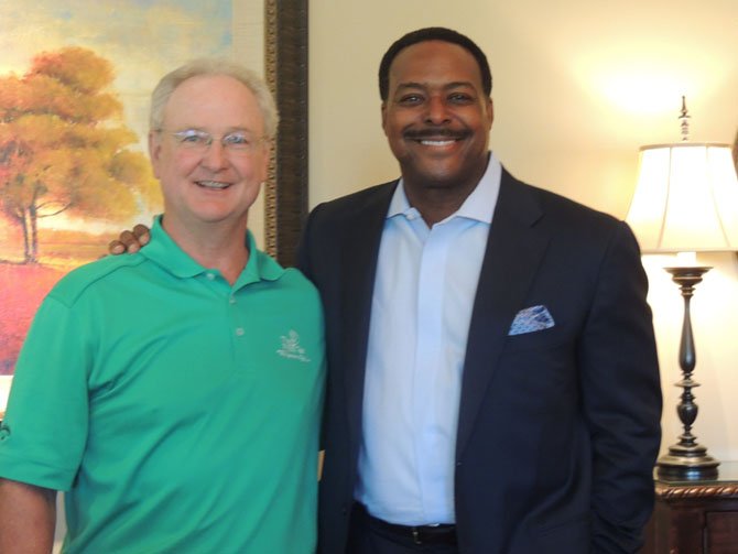 Chairman of the Board of Directors of The First Tee Pat Price with emcee Leon Harris of WJLA Channel 7 TV.
